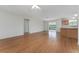 Spacious living room featuring hardwood floors, light walls, and neutral colors at 2712 Benavides Dr, The Villages, FL 32162