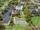 A beautiful view of the community pool area with shuffleboard courts and meticulously kept grounds at 3156 Vandenberg Ct, The Villages, FL 32163