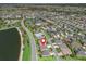 Community aerial view shows the location of this lakefront home with tennis courts, and parking at 3156 Vandenberg Ct, The Villages, FL 32163