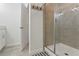 Bright bathroom with a glass enclosed shower and a convenient towel rack at 3180 Paradox Circle # 106, Kissimmee, FL 34746