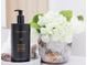 Close-up of a stylish bathroom counter with luxury hand soap and a decorative floral arrangement at 3180 Paradox Circle # 106, Kissimmee, FL 34746