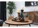 Close-up of living room decor with candles, decorative pieces, and a potted plant on a wooden table at 3180 Paradox Circle # 106, Kissimmee, FL 34746