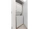 Compact laundry area with a stacked washer and dryer, maximizing space at 3180 Paradox Circle # 106, Kissimmee, FL 34746