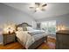 Serene bedroom featuring hardwood floors, vaulted ceilings, with plantation shutters and ample natural light at 3186 Killington Loop, The Villages, FL 32163