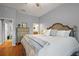 Comfortable bedroom featuring hardwood floors and a calming color scheme at 3186 Killington Loop, The Villages, FL 32163