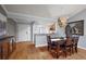 Inviting dining room featuring an elegant light fixture, and seamless flow into the adjacent kitchen at 3186 Killington Loop, The Villages, FL 32163