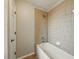 Tiled shower and tub combination with a white showerhead, faucet and a soap dish at 3234 Cypress Grove Dr, Eustis, FL 32736
