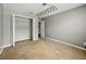 This bedroom features neutral walls, carpet and closet space at 3234 Cypress Grove Dr, Eustis, FL 32736