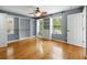 Bedroom with wood floor, ceiling fan, and windows with plenty of light at 3234 Cypress Grove Dr, Eustis, FL 32736