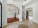 Spacious foyer with tile accents leads to dining and living areas, staircase on the right at 3234 Cypress Grove Dr, Eustis, FL 32736