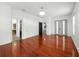 This living room features hardwood floors, neutral walls, and multiple entryways at 3234 Cypress Grove Dr, Eustis, FL 32736