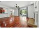 Spacious living room with hardwood floors, fireplace, and sliding glass doors at 3234 Cypress Grove Dr, Eustis, FL 32736