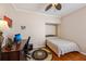 Cozy bedroom with murphy bed, ceiling fan, and stylish round rug at 32800 Oak Park Dr, Leesburg, FL 34748