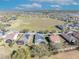 Aerial view of homes featuring solar panels, outdoor patios, and beautifully landscaped yards in a well-planned community at 341 Silver Maple Rd, Groveland, FL 34736