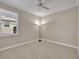 Neutral bedroom featuring a ceiling fan, natural light, and carpet at 341 Silver Maple Rd, Groveland, FL 34736