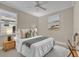 Cozy bedroom featuring a ceiling fan, neutral paint, and decor perfect for relaxation at 341 Silver Maple Rd, Groveland, FL 34736