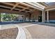 Covered entrance and paver driveway with manicured landscaping at the property entrance at 341 Silver Maple Rd, Groveland, FL 34736