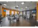 Fully equipped gym with a variety of machines and natural light from large windows at 341 Silver Maple Rd, Groveland, FL 34736