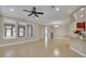 Bright and open living area with tile floors and large windows at 341 Silver Maple Rd, Groveland, FL 34736