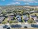 Street view of homes in neighborhood featuring solar panels, mature trees, and well-maintained lawns at 341 Silver Maple Rd, Groveland, FL 34736