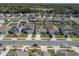 Aerial view of houses on Holly Grove Lane, each with fenced-in yards, landscaping, and driveways at 3719 Holly Grove Ln, Mount Dora, FL 32757