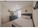 Well decorated bedroom featuring a large dresser, mirror, floral bedding, and a carpeted floor at 3719 Holly Grove Ln, Mount Dora, FL 32757