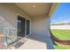 View of a covered patio area featuring a birdcage, hammock, and sliding glass doors at 3719 Holly Grove Ln, Mount Dora, FL 32757