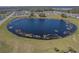 Scenic community pond offers a peaceful view surrounded by neighborhood homes and lush green spaces at 3719 Holly Grove Ln, Mount Dora, FL 32757