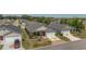 Aerial view of a well-maintained home with manicured landscaping and a decorative driveway at 3786 Stephanie Way, The Villages, FL 32163