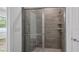 Modern bathroom featuring a glass enclosed shower with tiled walls at 40691 E 9Th Ave, Umatilla, FL 32784