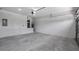 Spacious garage with sealed concrete floor, storage water heater, and good lighting at 40691 E 9Th Ave, Umatilla, FL 32784