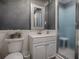 Bathroom with a white vanity, framed mirror, and a glass-enclosed shower at 481 Belle Ayre Dr, Mount Dora, FL 32757