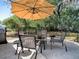 Outdoor patio featuring a patio table set with umbrella, providing a great spot for relaxing outdoors at 481 Belle Ayre Dr, Mount Dora, FL 32757