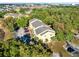 Aerial view of a building with parking and surrounded by trees at 5255 Images Cir # 207, Kissimmee, FL 34746