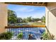 Balcony view overlooking the parking lot and landscaped grounds at 5255 Images Cir # 207, Kissimmee, FL 34746