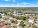 Panoramic aerial view of a residential neighborhood near a lake and a scenic landscape at 5645 Huntington St, Leesburg, FL 34748