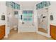 Bright bathroom featuring a glass shower and soaking tub with nautical accents at 5645 Huntington St, Leesburg, FL 34748