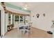 Cozy dining area with natural light from the bay windows at 5645 Huntington St, Leesburg, FL 34748