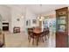 Inviting dining area with a wooden table set and large windows providing ample natural light at 5645 Huntington St, Leesburg, FL 34748