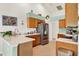 Bright kitchen featuring tile floors, stainless steel refrigerator and a stylish backsplash at 5645 Huntington St, Leesburg, FL 34748