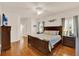 Spacious main bedroom featuring hardwood floors and a serene ambiance at 5645 Huntington St, Leesburg, FL 34748