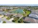 This aerial view displays the property's lakeside setting and the surrounding residential neighborhood at 5835 Hensley Ave, The Villages, FL 32163