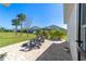 Outdoor seating area with grill and view of neighboring homes at 5835 Hensley Ave, The Villages, FL 32163