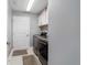 Bright laundry room with modern washer and dryer units at 5835 Hensley Ave, The Villages, FL 32163