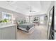 Light and airy main bedroom with tray ceiling, plantation shutters, neutral decor, and great natural light at 5835 Hensley Ave, The Villages, FL 32163