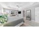 Light and airy main bedroom with tray ceiling, plantation shutters, neutral decor, and great natural light at 5835 Hensley Ave, The Villages, FL 32163