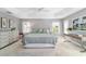 Light and airy main bedroom with tray ceiling, plantation shutters, neutral decor, and great natural light at 5835 Hensley Ave, The Villages, FL 32163