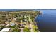 Panoramic aerial showing homes nestled alongside the serene lake at 603 N Lakeshore Blvd, Howey In The Hills, FL 34737