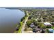 Panoramic aerial showing homes nestled alongside the serene lake at 603 N Lakeshore Blvd, Howey In The Hills, FL 34737