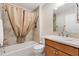 Bathroom with a shower and bathtub combination, tile surround, and vanity at 6088 Keckonen Dr, The Villages, FL 32163